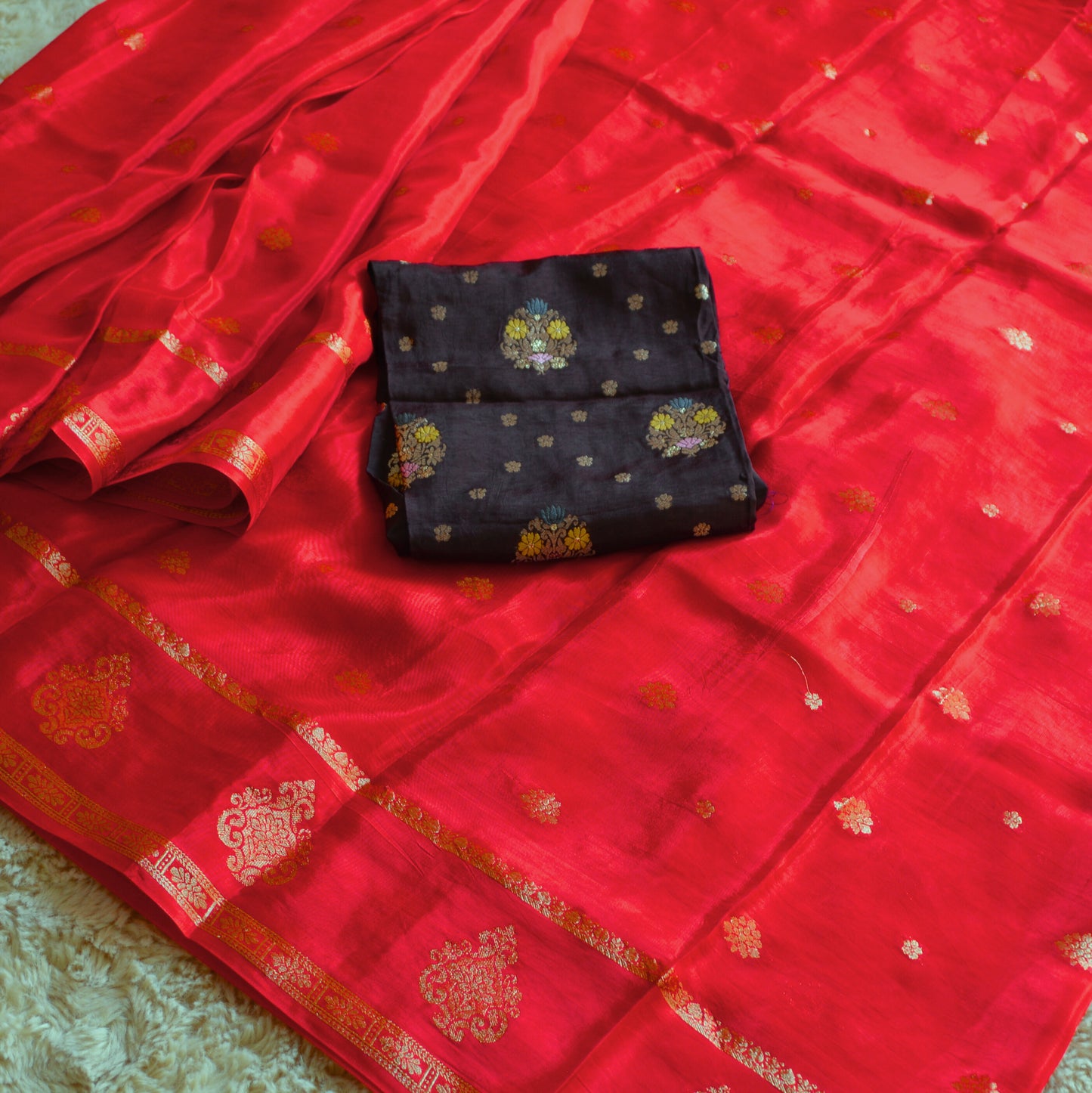 red and brown blouse chinnon butta border saree