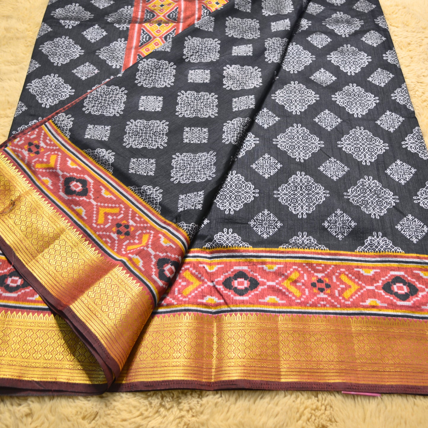 Black with maroon patola saree