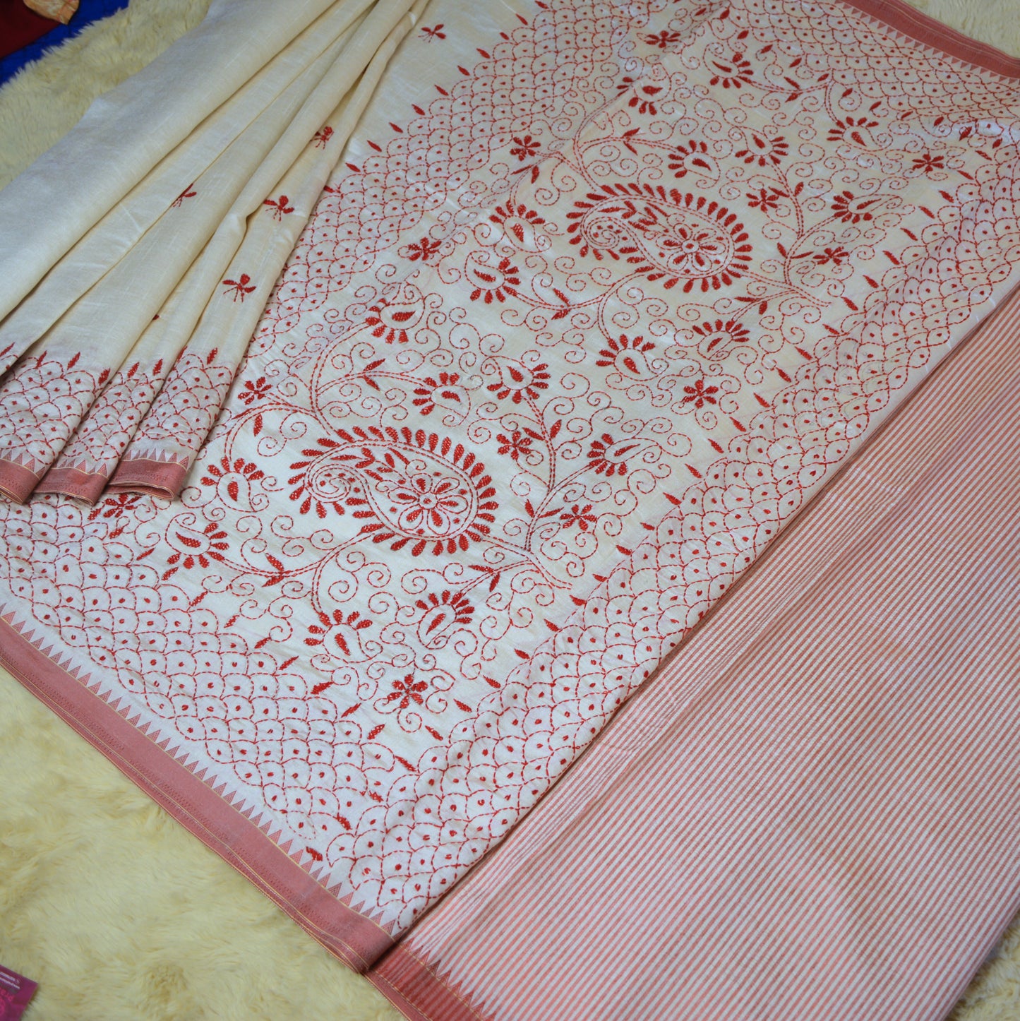 Half white tussar saree with red kashmir embroidery