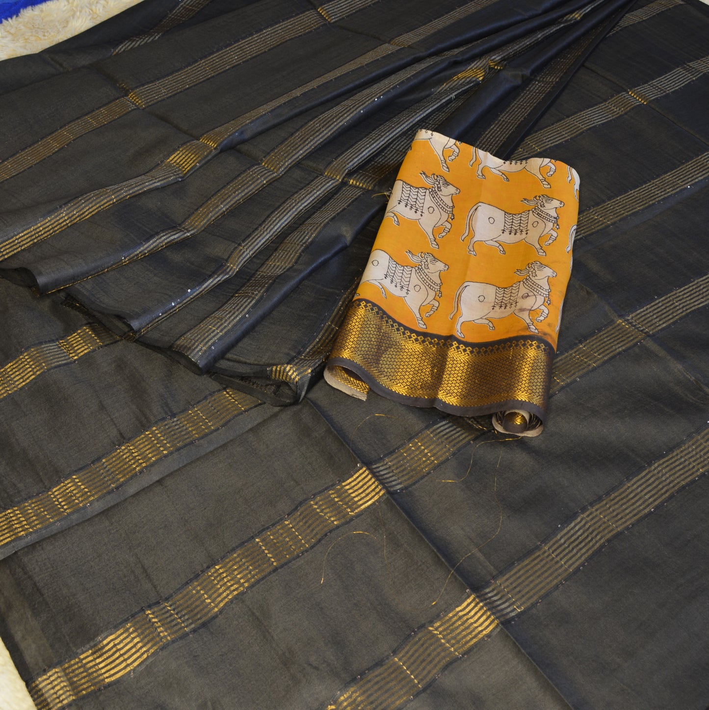Black moonga silk saree with kalamkari blouse