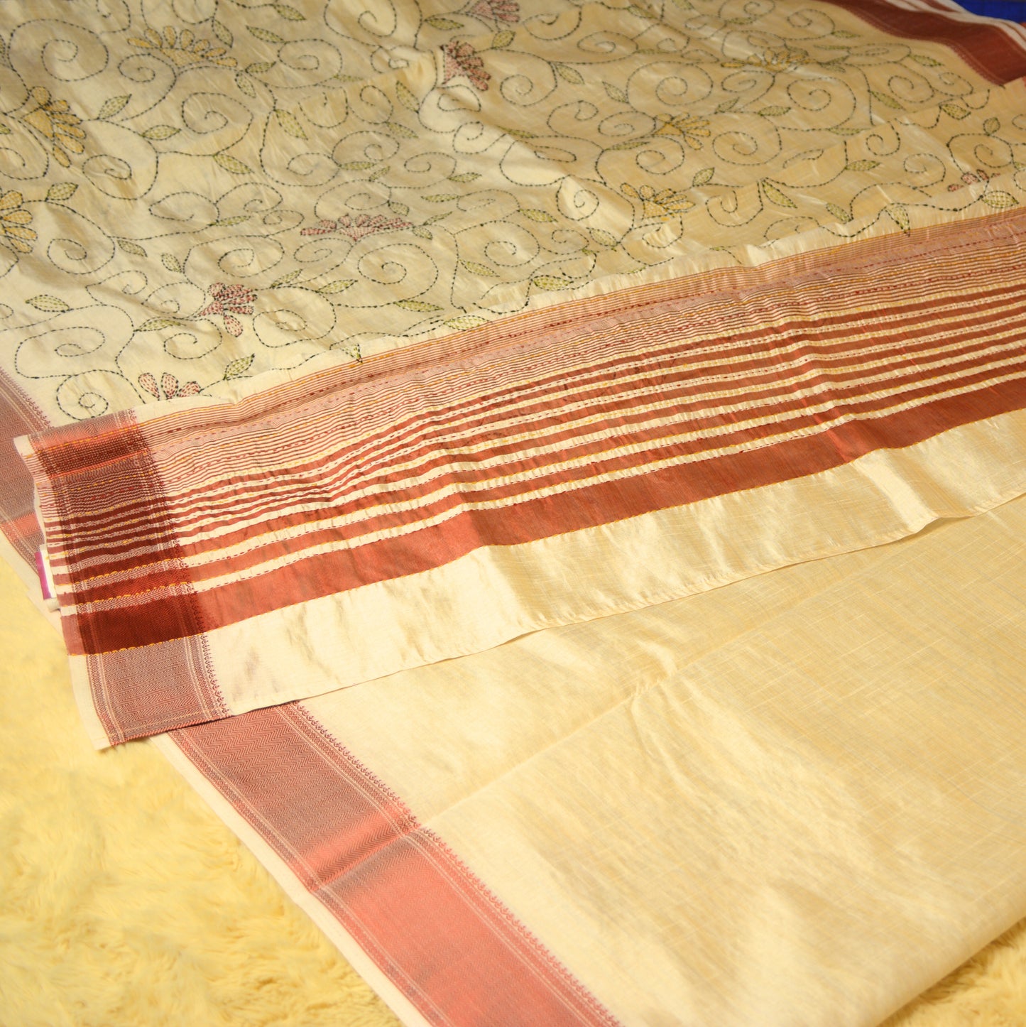 Half-white tussar saree with kantha embroidery