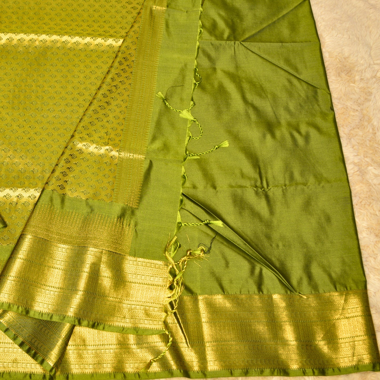 Black and green semi soft silk temple border saree