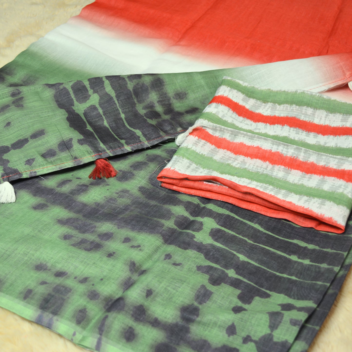 Orange and green linen shiborl print saree