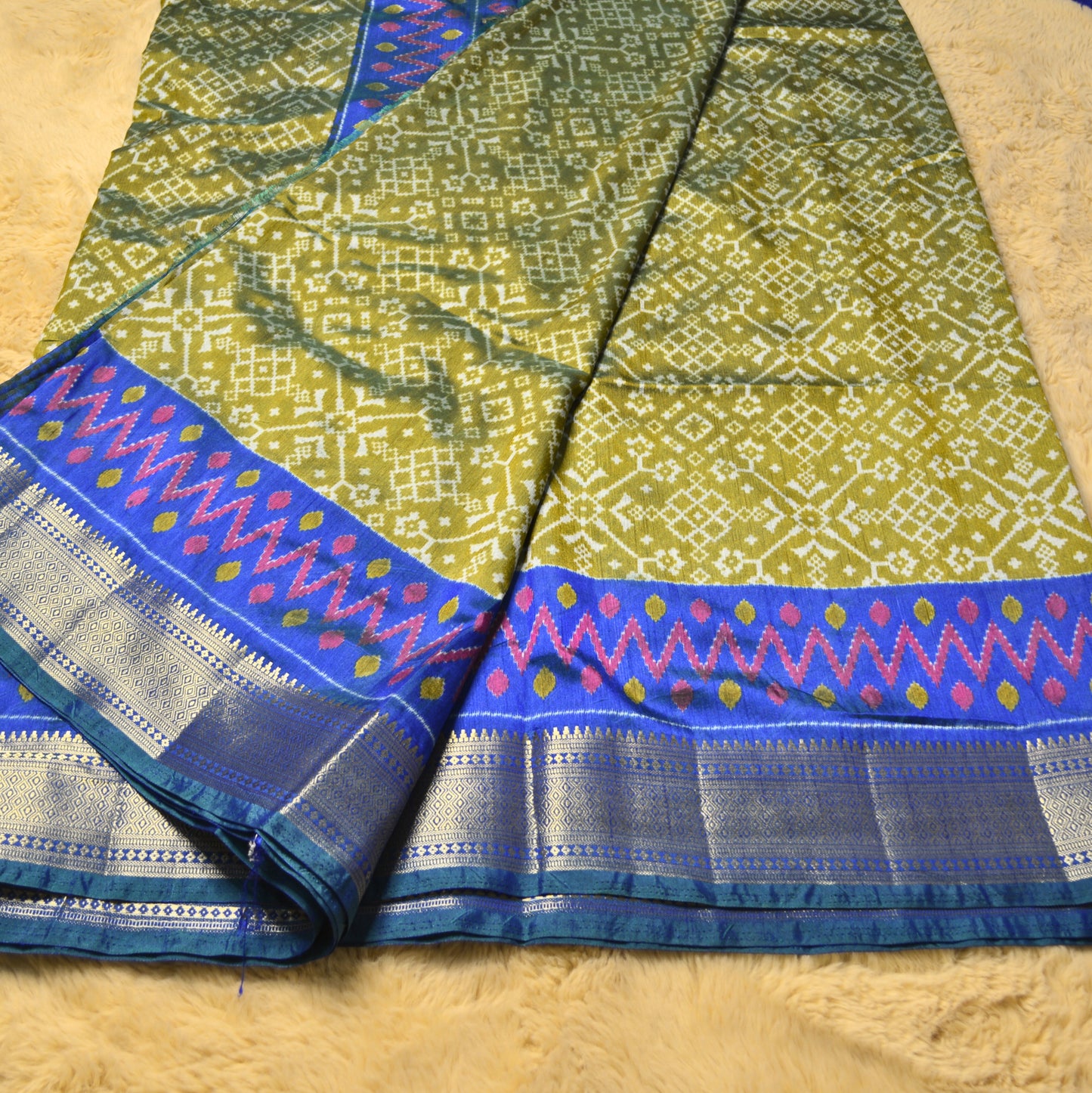 Green with blue patola saree
