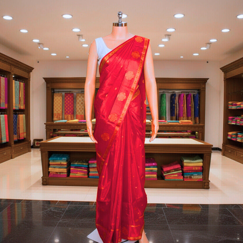 red and half white chinnon butta border saree