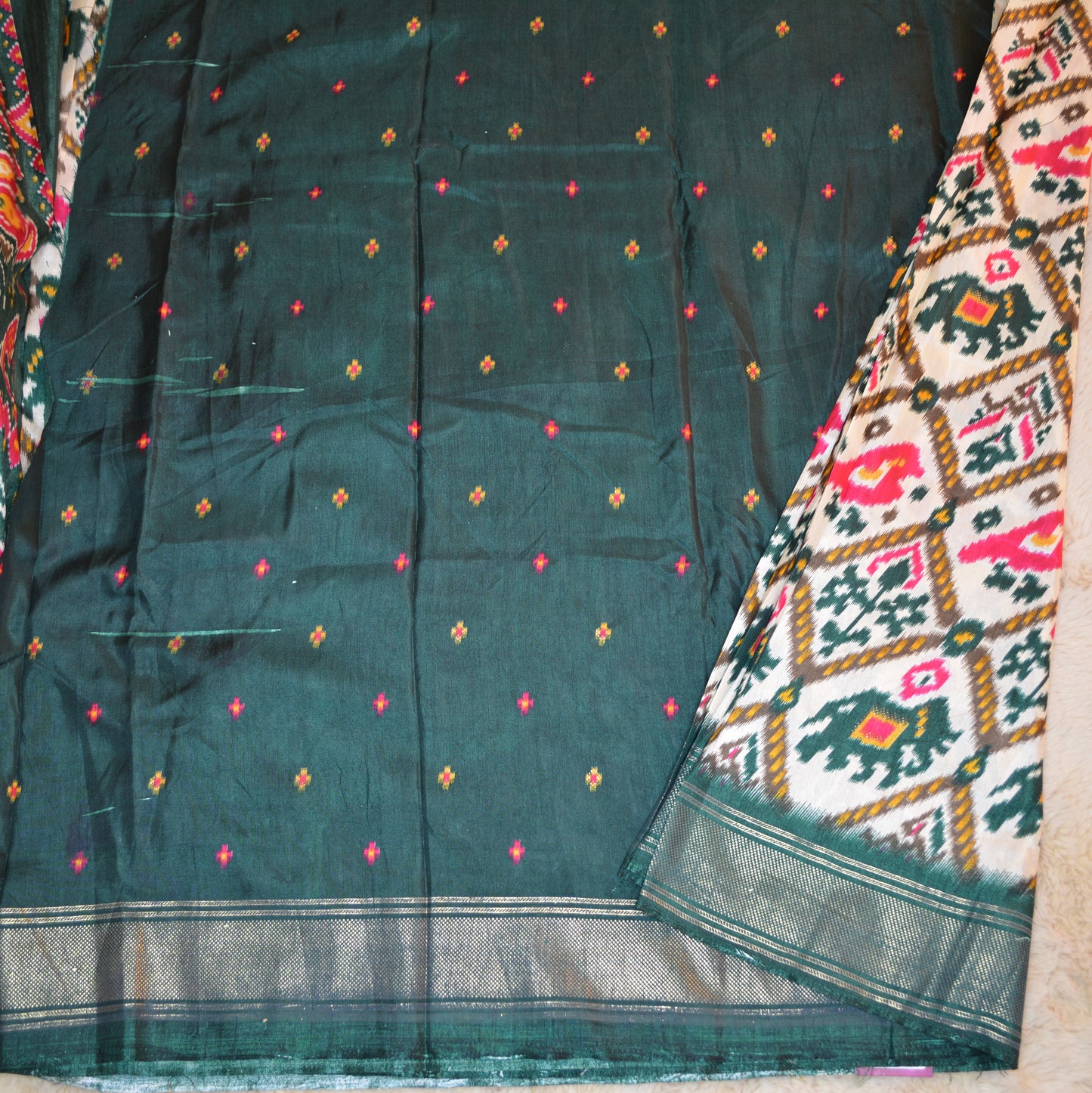 Half-white with green ikkat semi dola saree