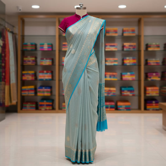 Pastel blue viscose georgette saree with buttas