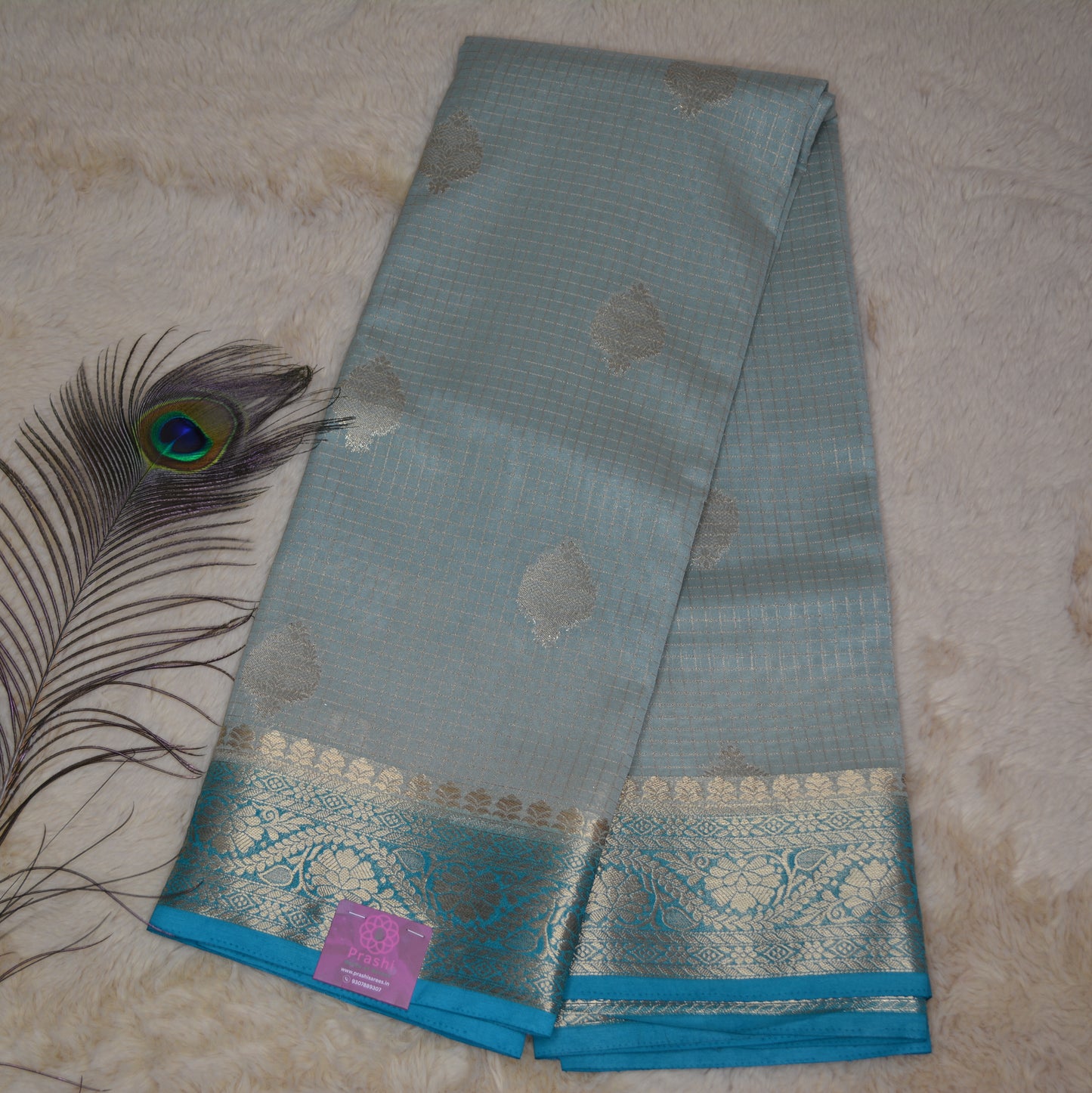 Pastel blue viscose georgette saree with buttas