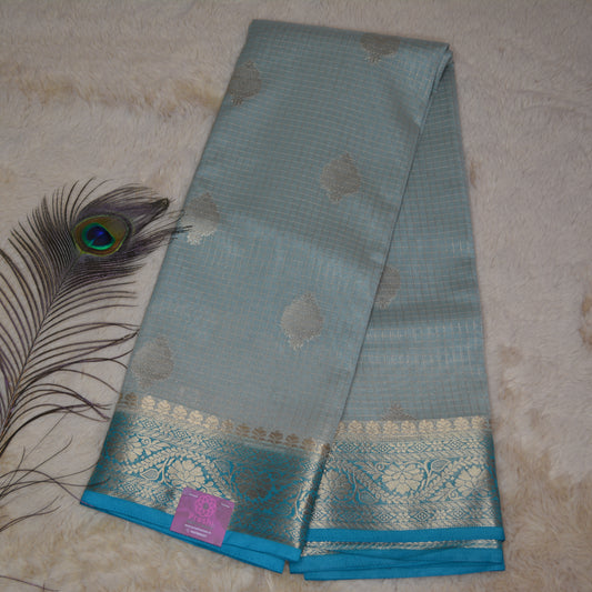 Pastel blue viscose georgette saree with buttas