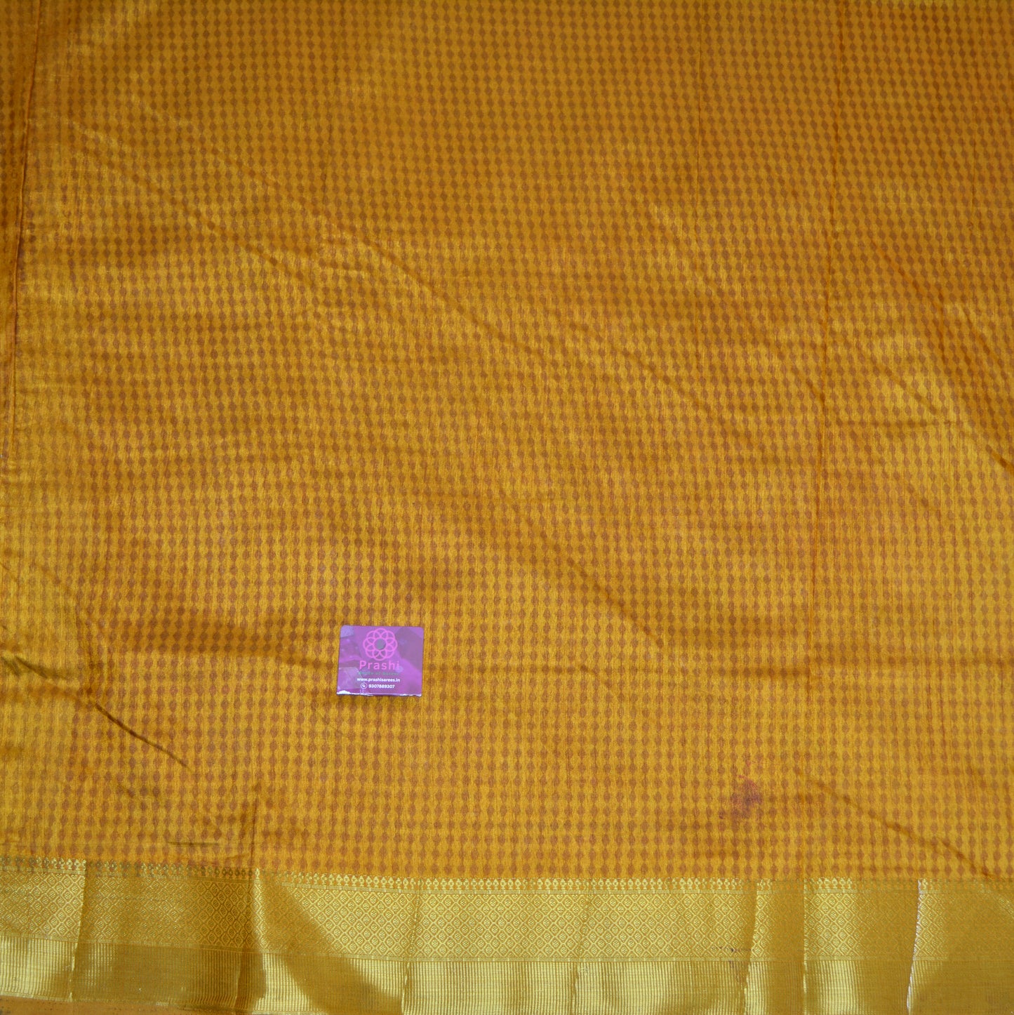 Beige with yellow patola saree