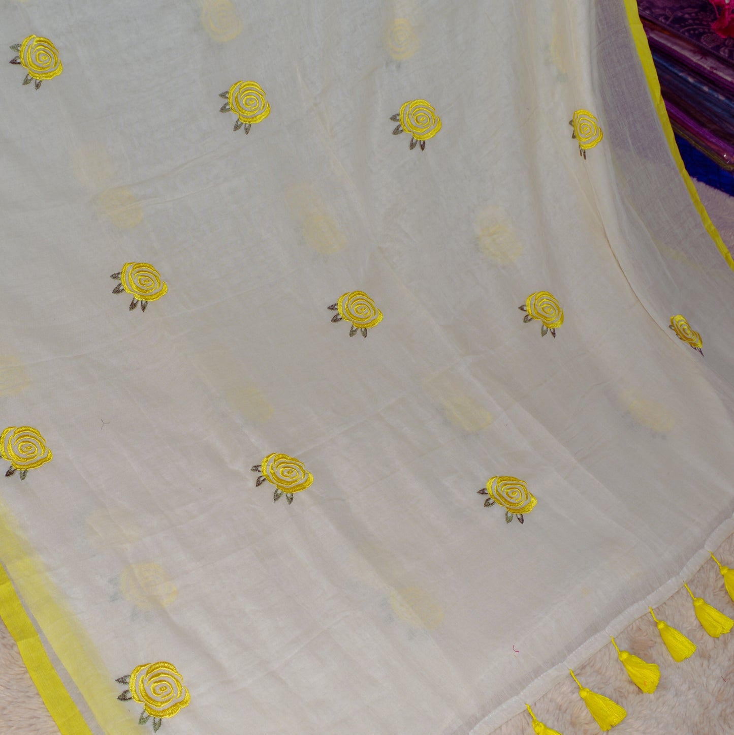 Half-white with yellow mul cotton embroidery saree.