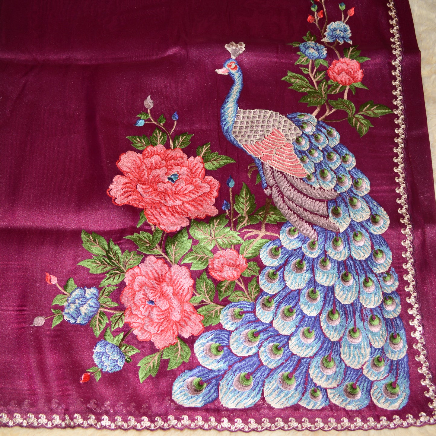 Magenta tissue saree with peacock embroidery.