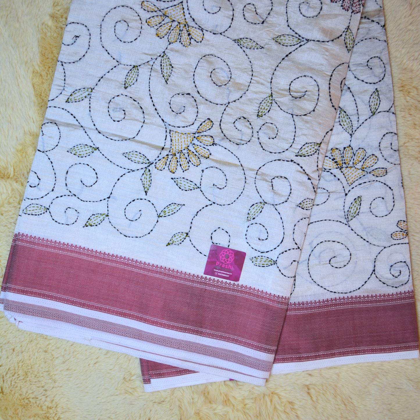 Half-white tussar saree with kantha embroidery