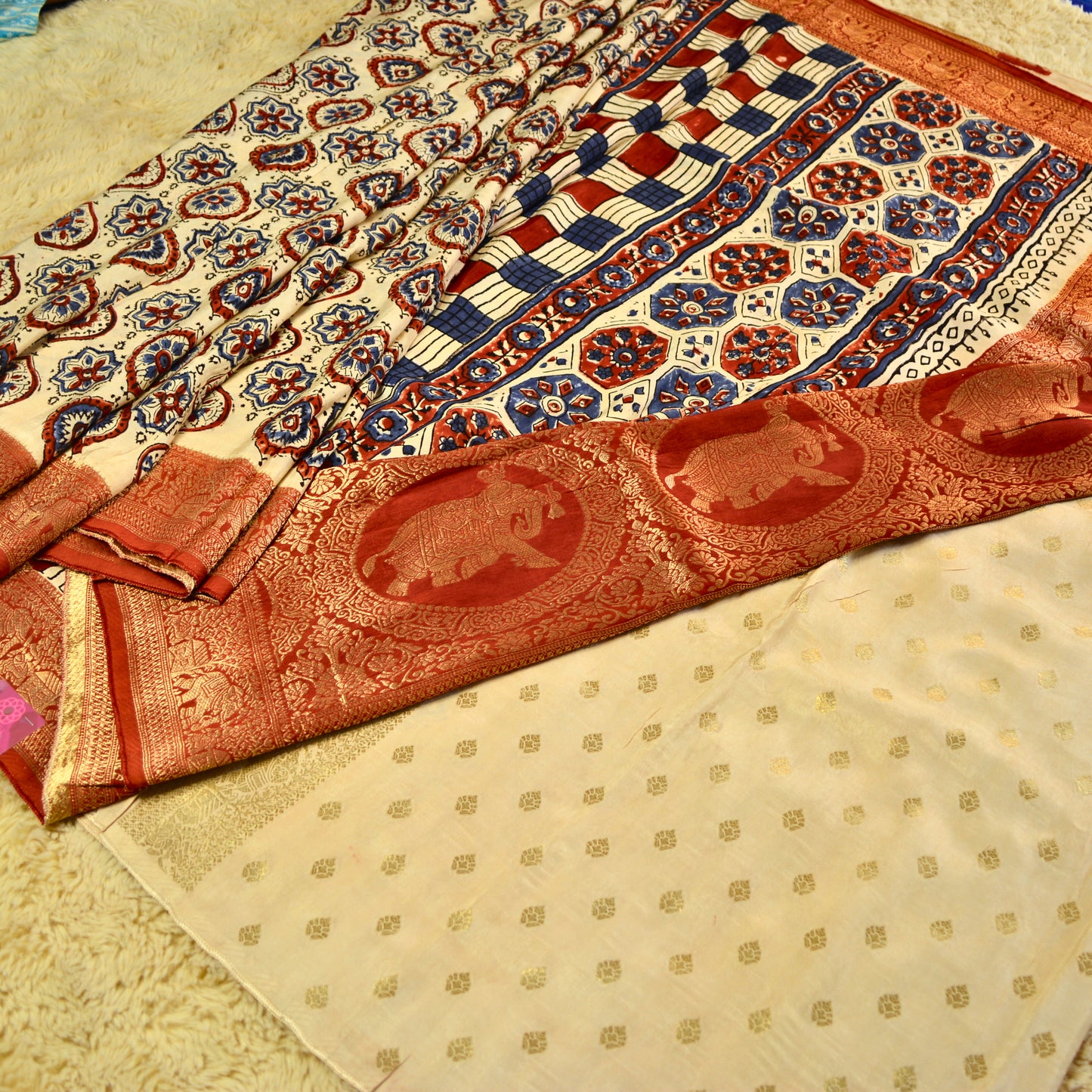 Cream dola silk saree with ajrakh handblock print