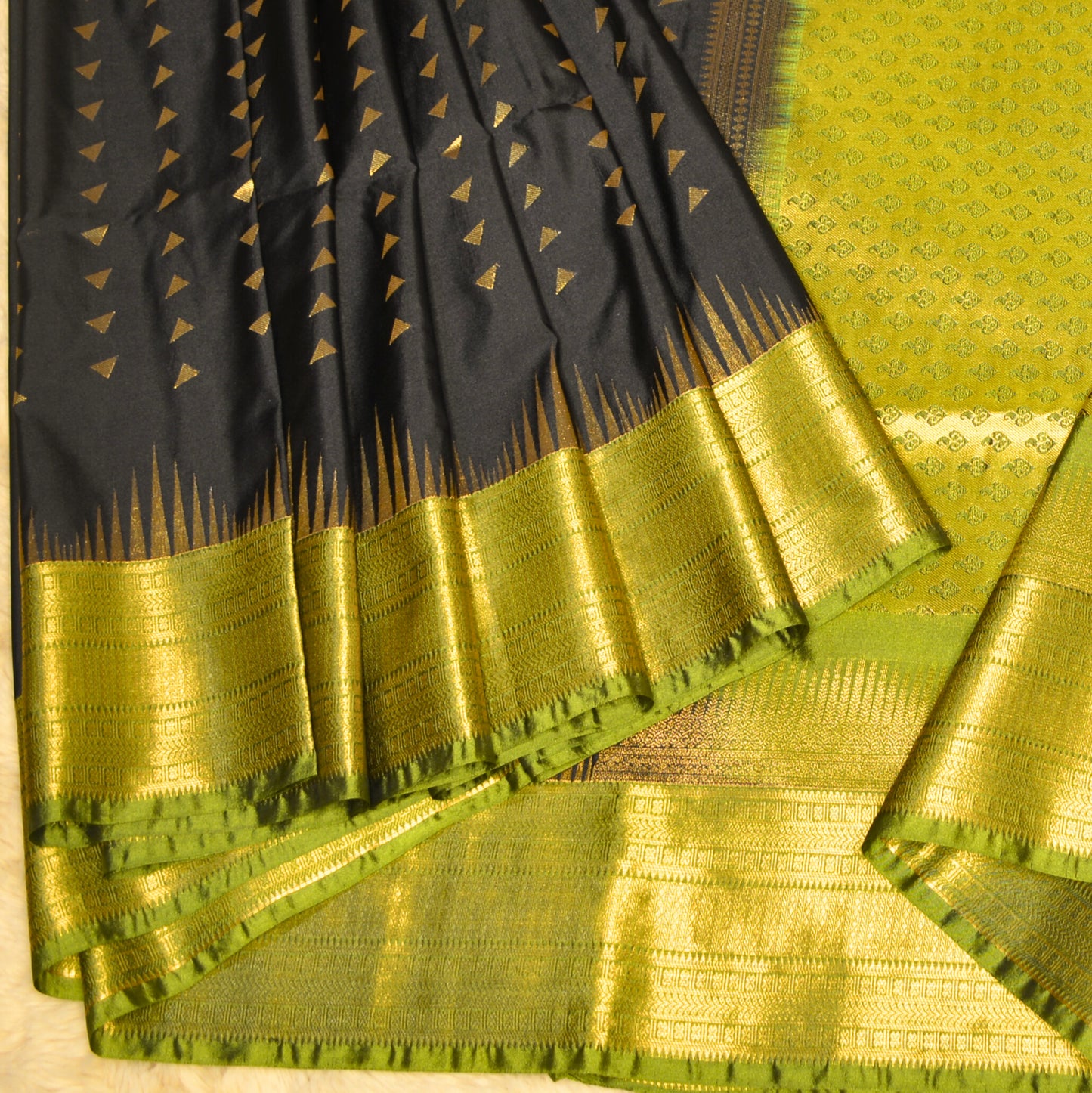 Black and green semi soft silk temple border saree