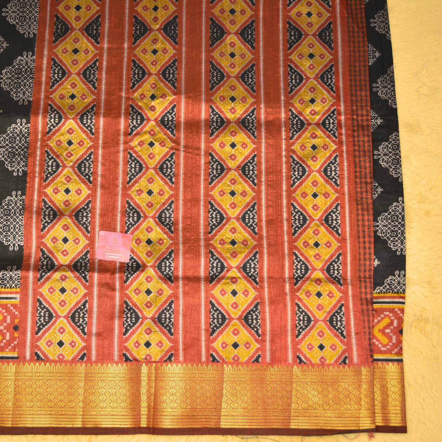 Black with maroon patola saree