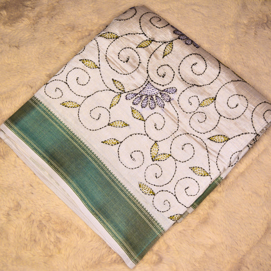 Half-white tussar saree with kantha embroidery