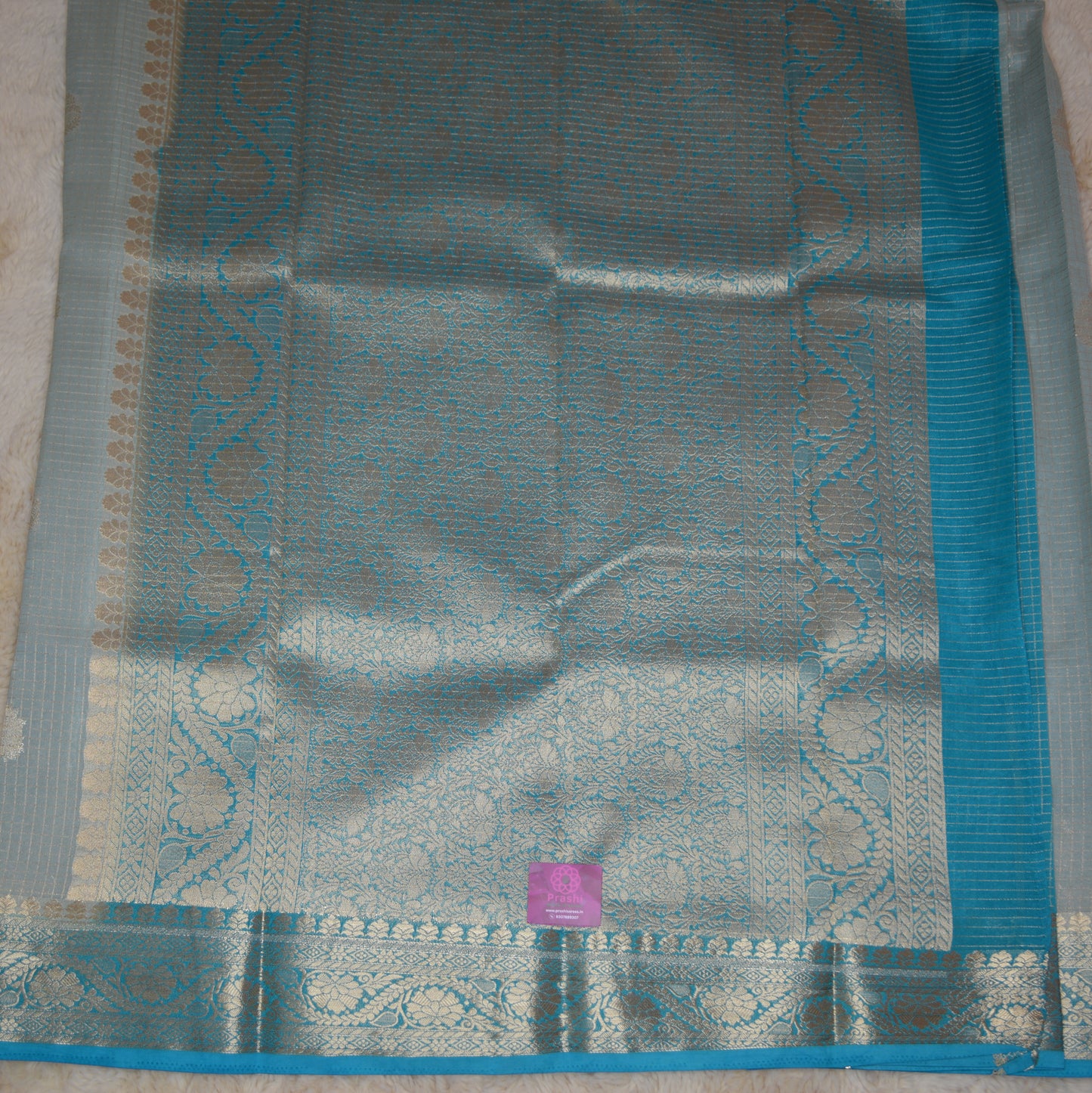 Pastel blue viscose georgette saree with buttas
