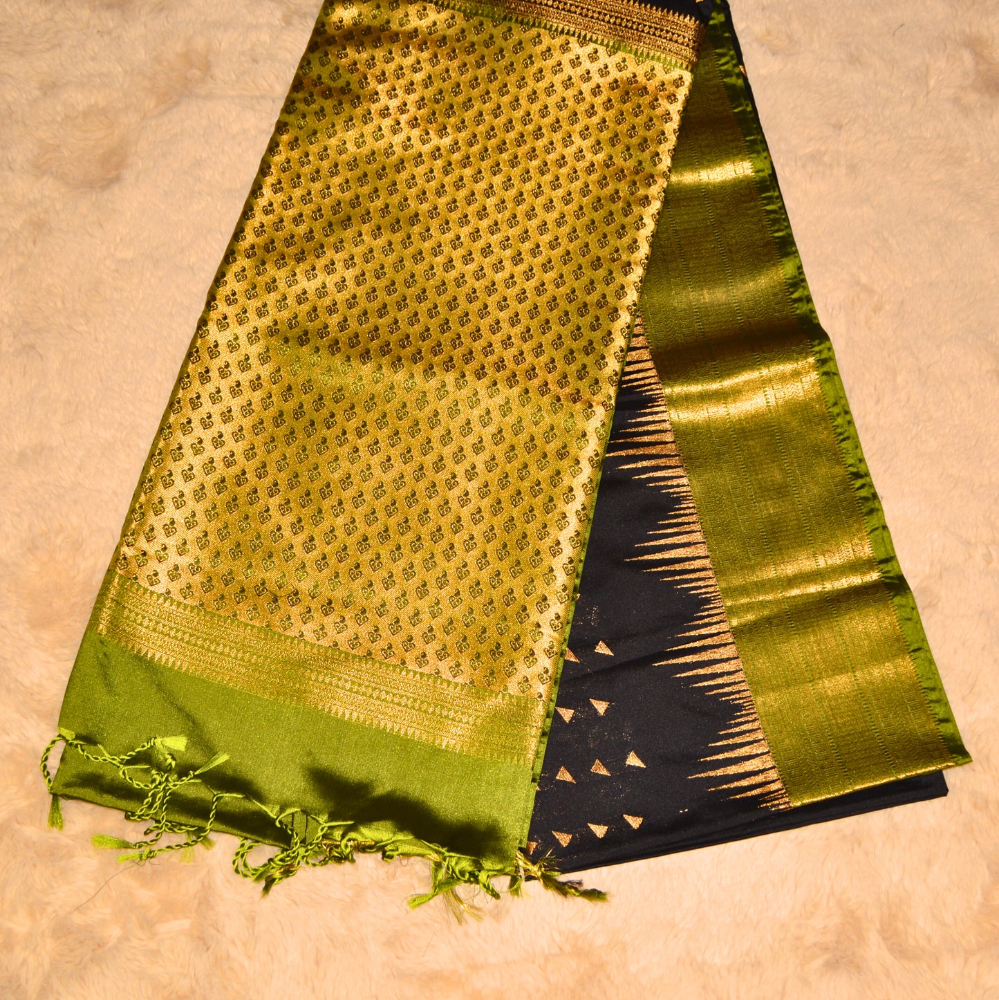 Black and green semi soft silk temple border saree