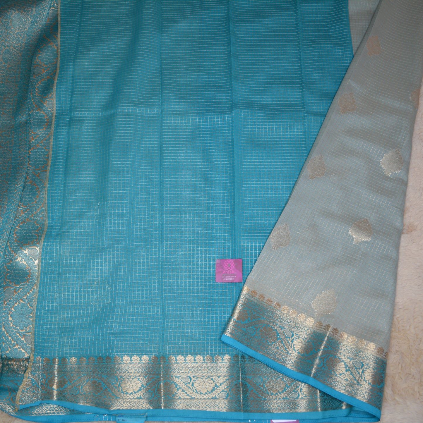 Pastel blue viscose georgette saree with buttas