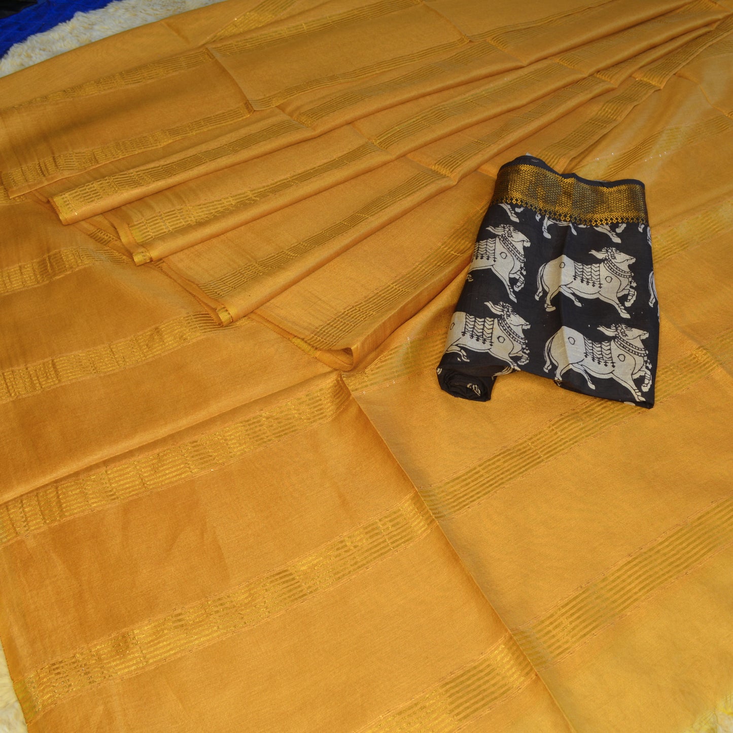 Yellow moonga silk saree with kalamkari blouse