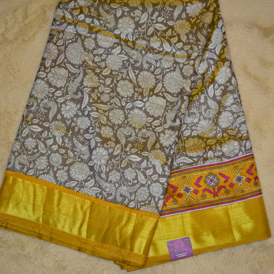Beige with yellow patola saree