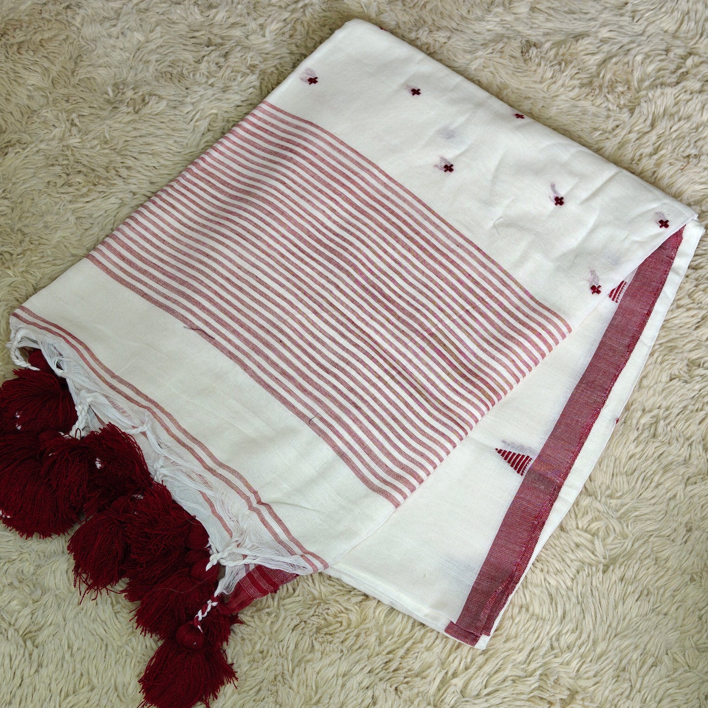 white handloom mul cotton plus butta saree
