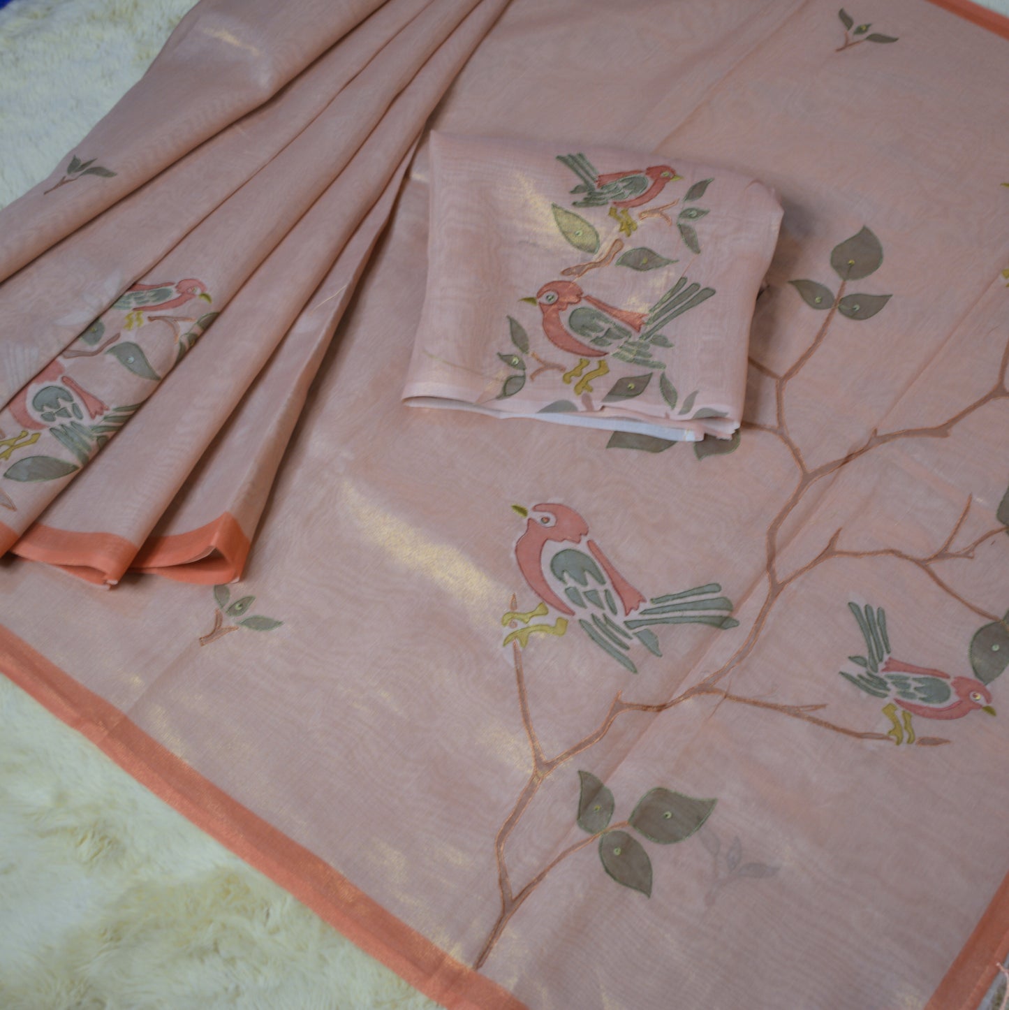 Pastel orange tissue applique work saree