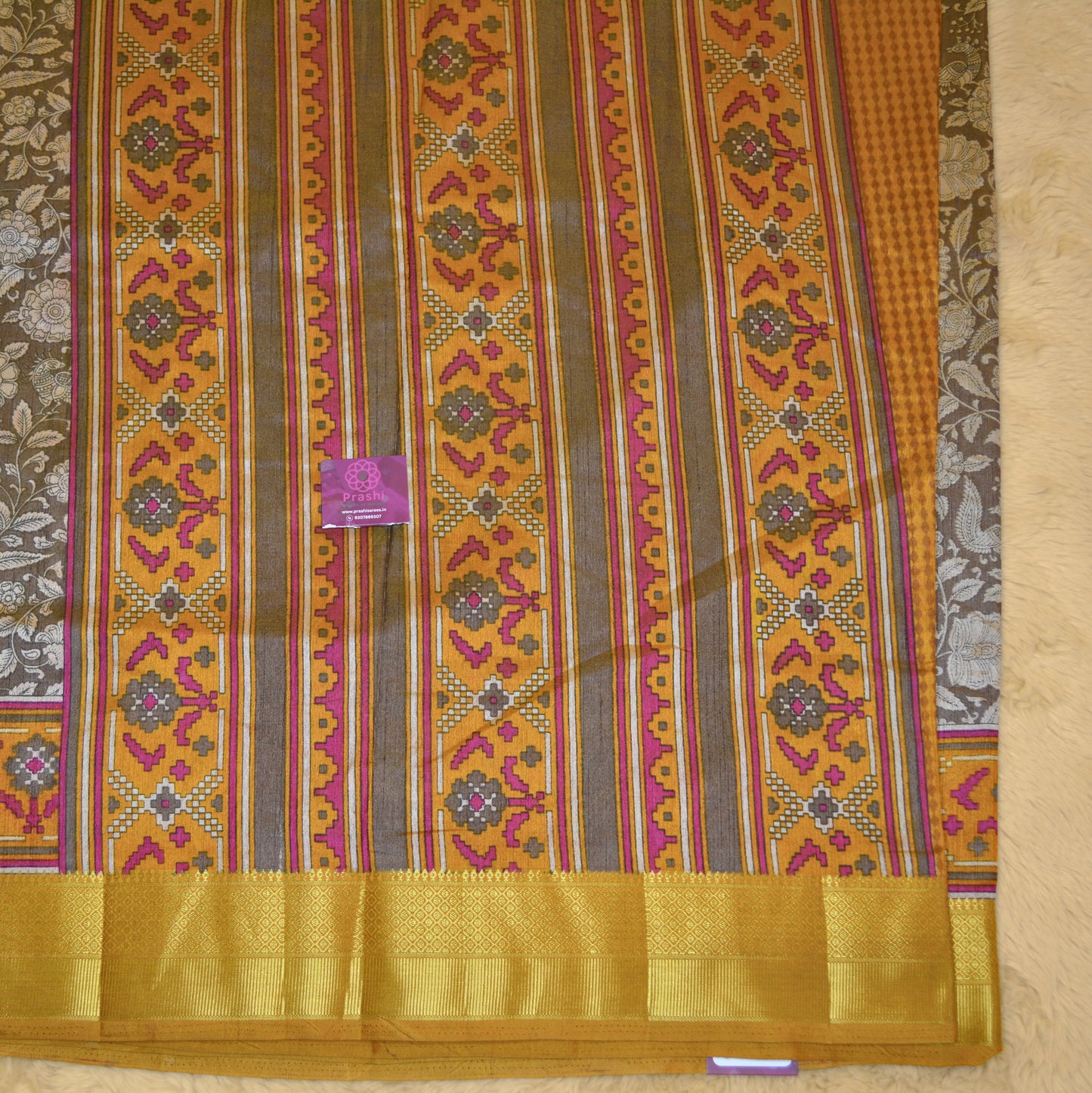 Beige with yellow patola saree