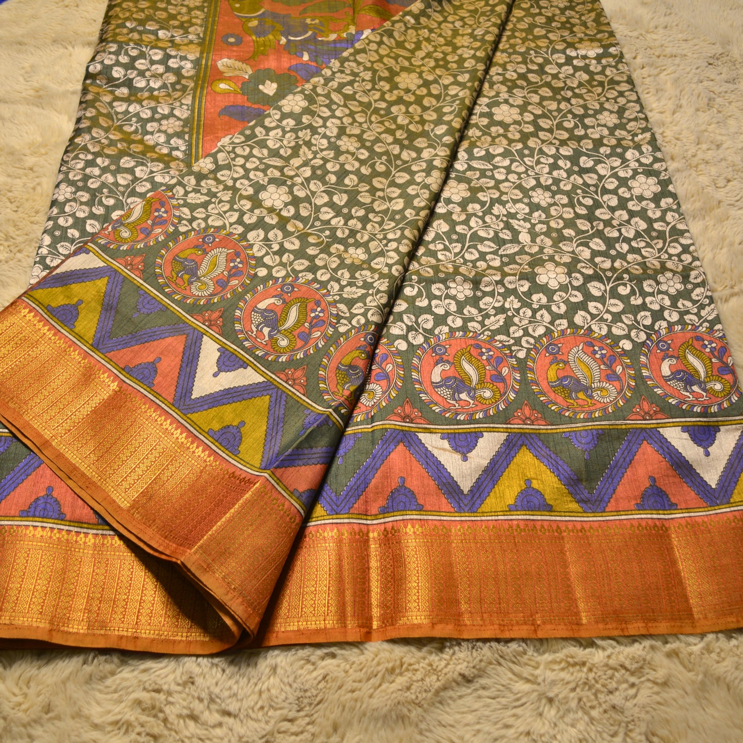 Mehandi green with rust orange patola saree